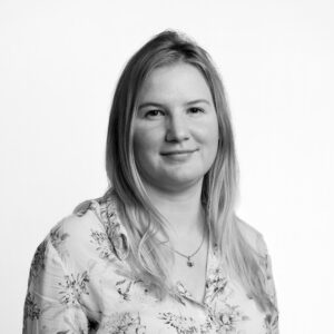 Kate Ledwoch standing in front of a white background