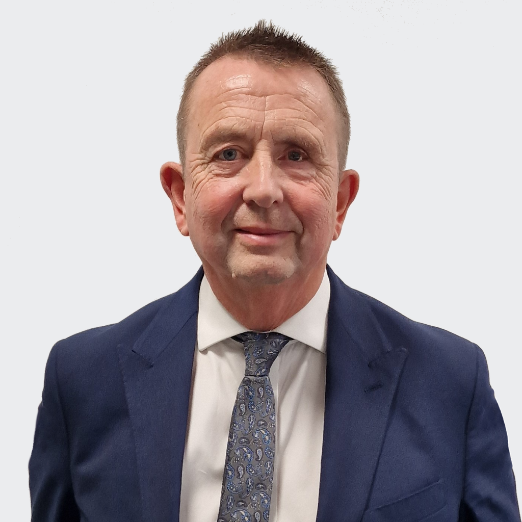 Man standing in front of a grey background