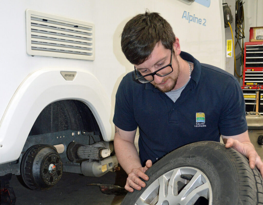 Josh Roberts inspecting wheel